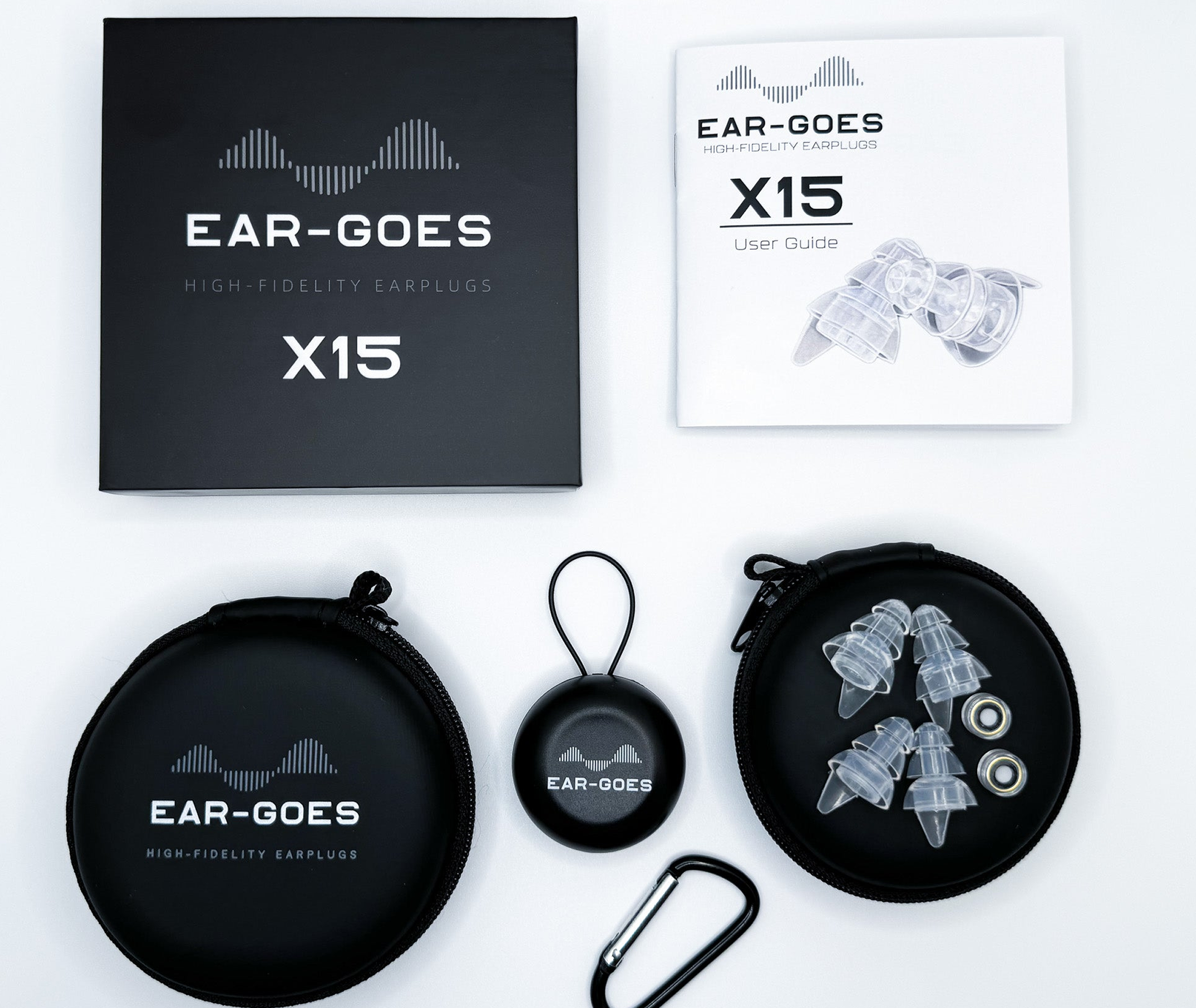 Ear-Goes X15 high-fidelity earplugs with audio filters, carrying case, clamshell, instruction manual, and box on a white background.